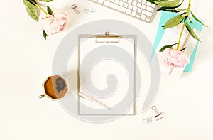 Flat lay women`s office desk.Mockup with clipboard,