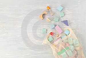 Flat lay with wooden  blocks in pastel colors. Eco friendly, zero waste, plastic free, educational, gender neutral toys for