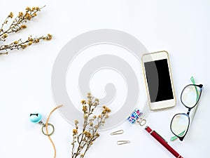 Flat Lay of workspaces with dry leaf