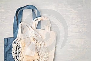 Flat lay of Zero waste kit. Set of eco friendly reusable mesh cotton bag. Sustainable, ethical, plastic free lifestyle concept