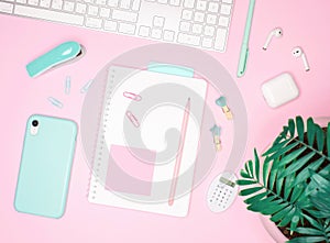 Flat layout on pink background with mint accesories