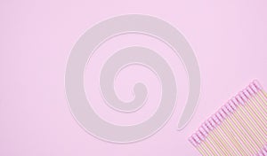 Flat layout of pink cotton buds