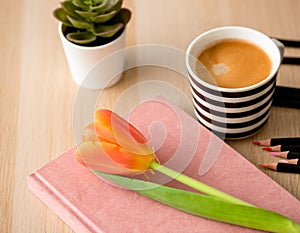 Flat lays orange tulips concetp for morning coffee from top views