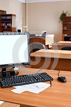 Flat lcd pc computer monitor with white isolated screen, empty office room