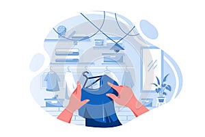 Flat man or woman hand choosing T-shirt in clothing store.