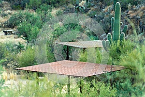 Flat metal awning in sabino national park for campers and for people to barbeque underneath in the summer heat