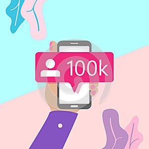 flat lay modern minimal hand holding mobile phone with new pink ten chiliad like followers social media iconon screen with shadow photo