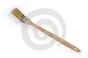 Flat paint brush with angled working part on white background photo