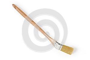 Flat paint brush with angled working part on white background photo