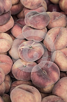 Flat peaches as a background