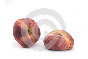 Flat peaches on a white background