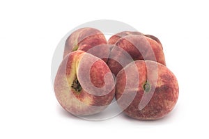 Flat peaches on a white background