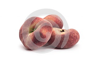 Flat peaches on a white background