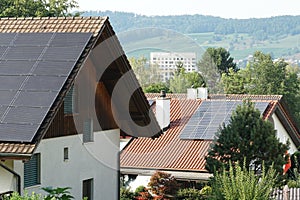 Flat plate or panels of solar collectors on the roofs of the the family house for active heating