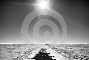 A flat prairie landscape in black and white