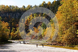 The flat rock and river bed at Taughannock Falls with the background of fall foliage in Upstate New York, U.S