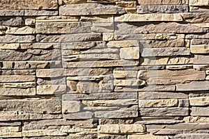 Flat rocks layered to form a solid wall photo