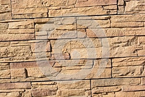 Flat rocks layered to form a solid wall photo