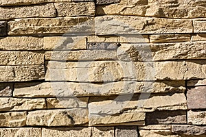Flat rocks layered to form a solid wall photo