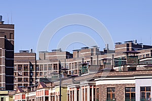 Flat roof with air conditioners on top modern apartment house building exterior mixed-use urban multi-family residential