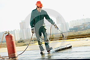Flat roof covering repair works with roofing felt