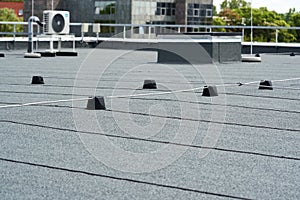 Flat roof protective covering with bitumen membrane for waterproofing photo