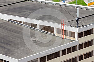 Flat roof top modern commercial building car garage exterior mixed-use urban multi-family residential area.