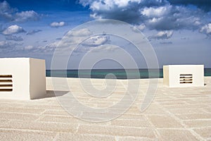 Flat roof view with the sea in the background