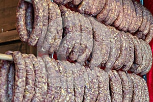 Flat sausages on farmer`s market in Vienna, Austria. Lukanka salami