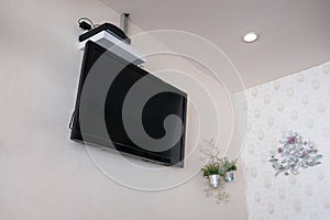 Flat screen tv lcd on wall with decor flower