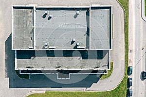 Flat shingle roof of industrial building. aerial top view