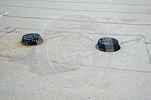 flat sloping membrane roof with roof drain and emergency overflow drain