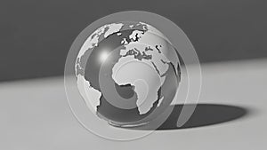 On a flat smooth surface casting a soft shadow to the right emphasizing