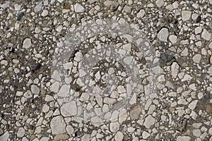 Flat surface of the coarse grained sedimentary rock conglomerate. Background with natural stone texture and pattern.