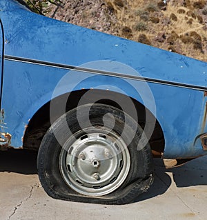 Flat tire of abandoned car