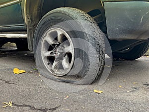 Flat tire of an allroad car, car breakage and changing wheels concept