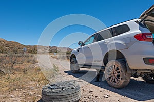 Flat Tire on Dusty Road