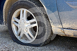 Flat Tire on Old Dirty Car