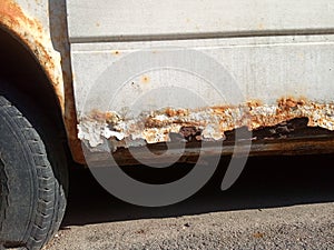 Flat tire and rusty car, old car elements