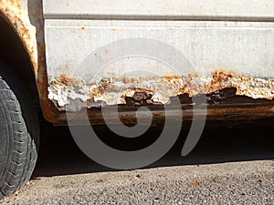 Flat tire and rusty car, old car elements