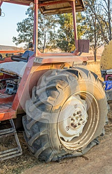 A flat tyre on a large tractor