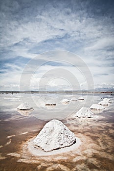 Flat uyuni salt and desert , infinite mirror and water, blue emotins sunset here exist landscape with  siluettes, storms and  beau