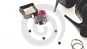 Flat womens shoes and accessories collage with black high-heeled shoes, jewelry, perfume earrings on a white background