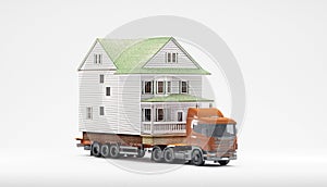 A flatbed articulated lorry loaded with a house isolated on a white background. Both are models. Good image for moving home themes