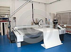 Flatbed cutter plotter in print shop photo