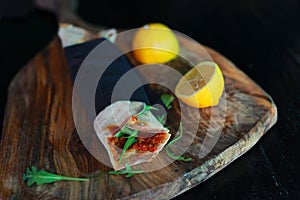 Flatbread lahmacun turkish pizza with mincedmeat, arugula, lemon photo