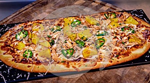 Flatbread Pizza with Pineapple and JalapeÃÂ±os photo