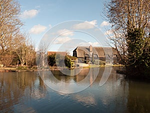 flatford black farm house mill house cottage from across the water