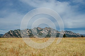 Flatiron Mountains with Dry Grassy Field