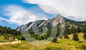 The Flatirons in Boulder, Colorado on a sunny summer day photo